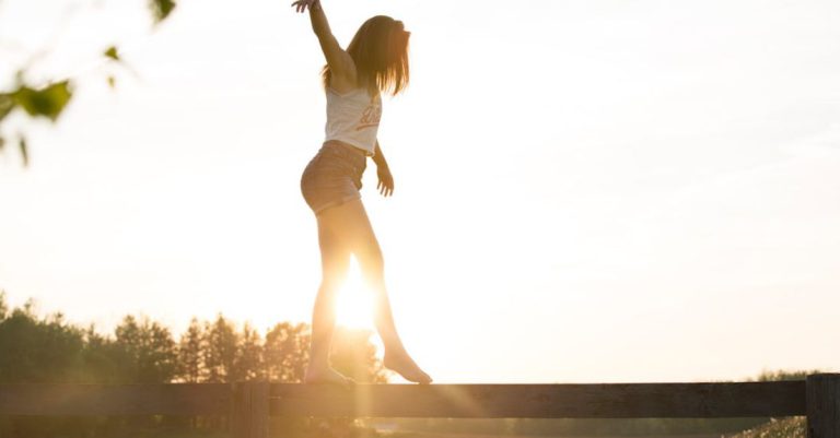 Balance - Woman Walking On Fence