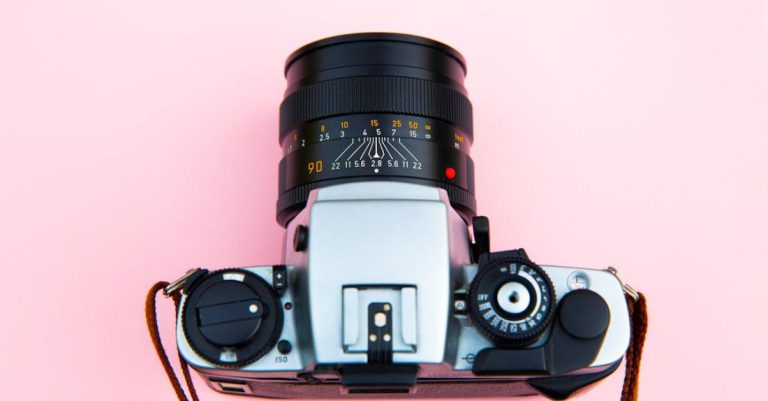 Body Image - Black and Silver Camera on Brown Wooden Table