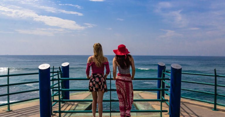 Appreciation - Two Women in Boat Looking at Ocean